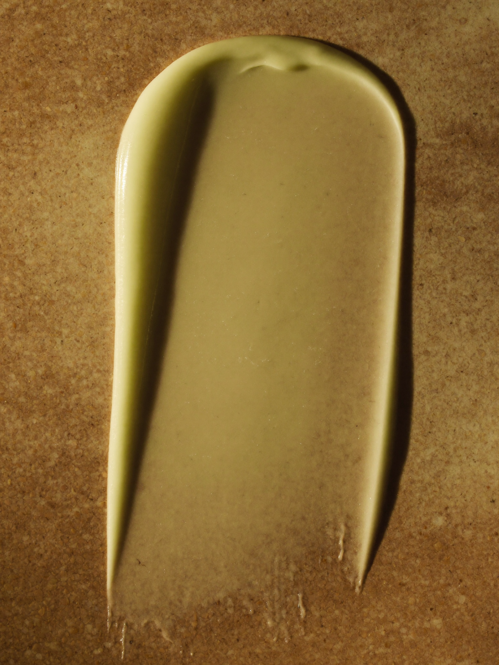 Lotion swatch showing the olive undertone