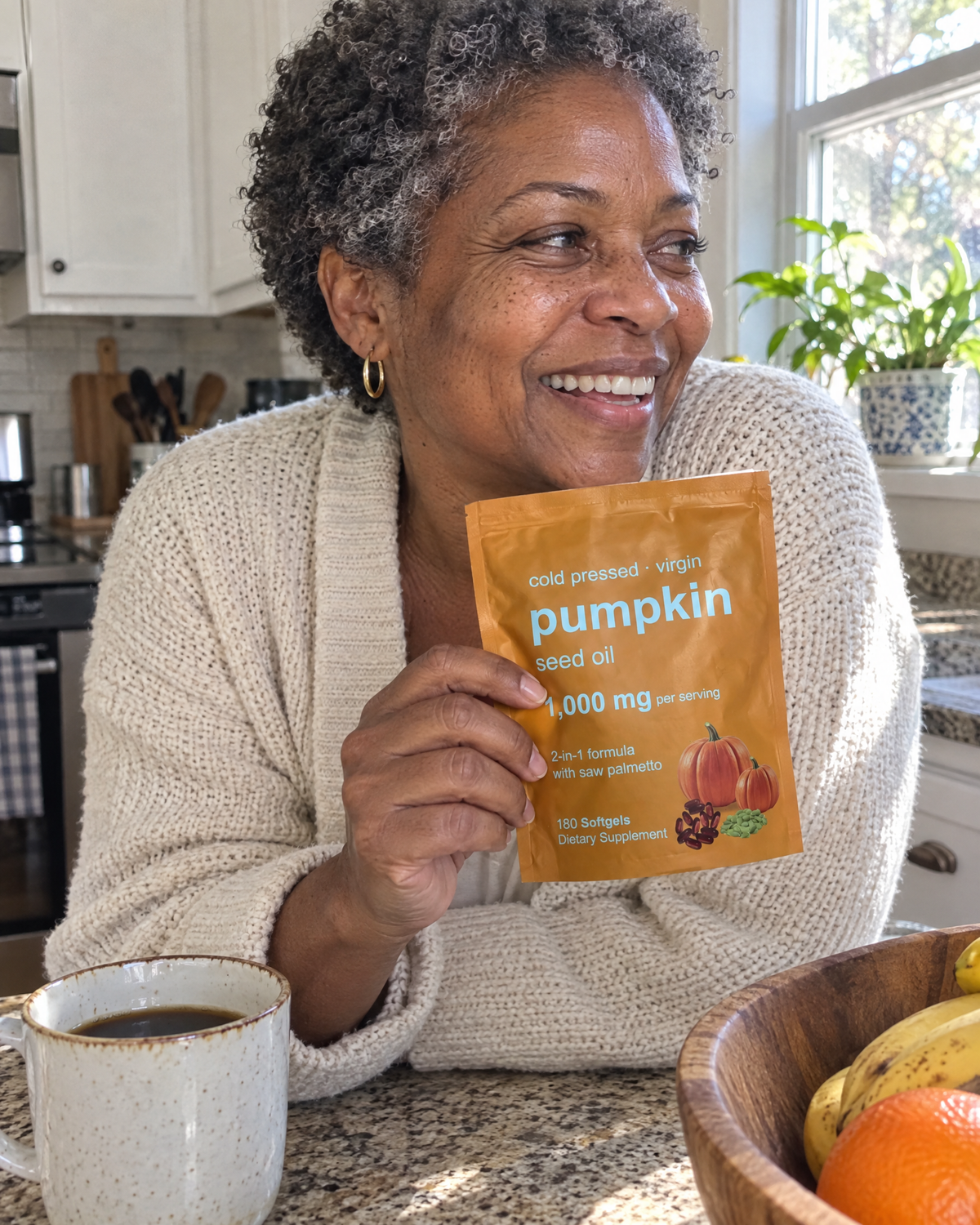 Woman in her kitchen holding the pouch