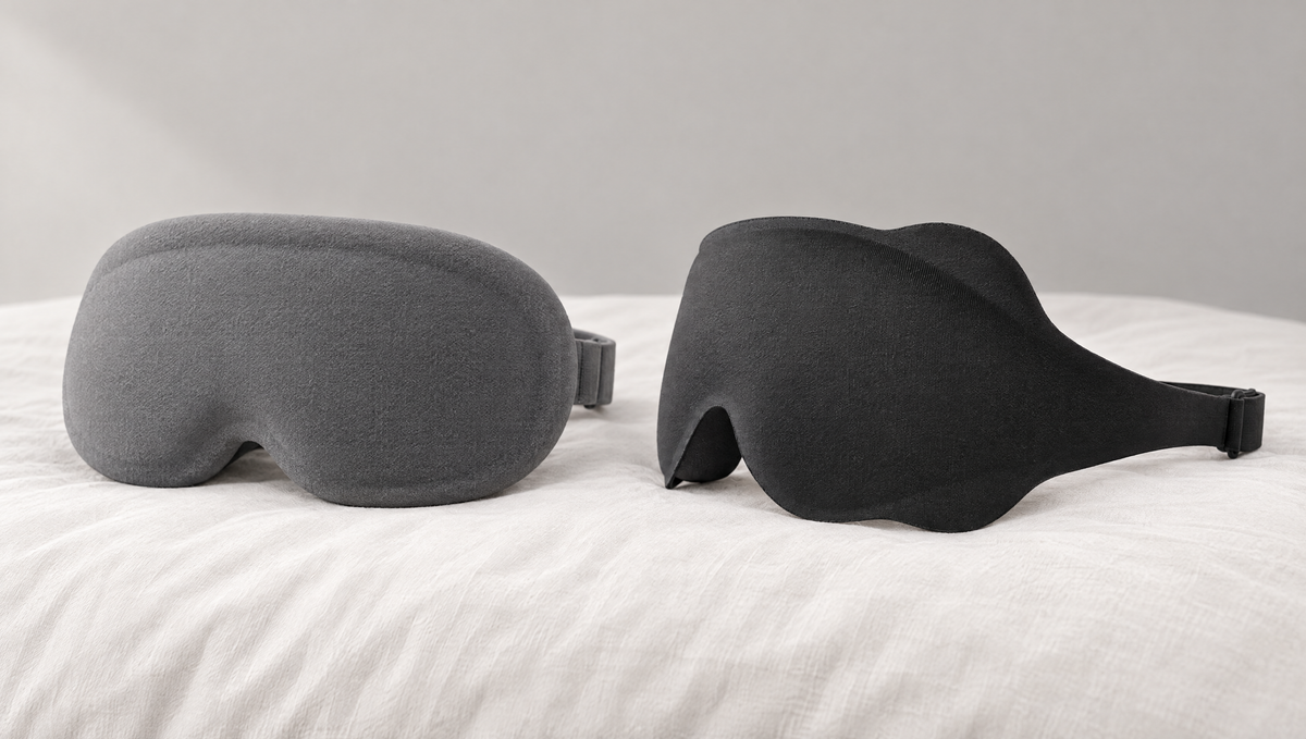 A bulky foam mask with a thick outer rim beside this mask, whose side wing lies low on the pillow